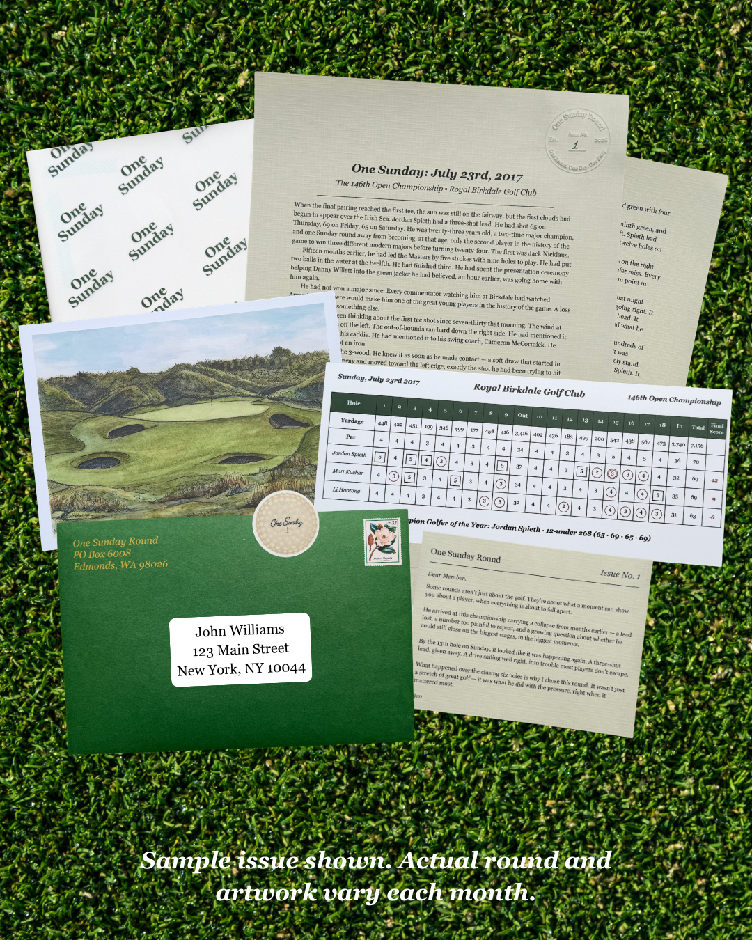 A sample issue of a golf club newsletter or invitation set laid out on artificial grass. The set includes printed cards, a golf course photo card, a green envelope, a round-robin sheet, and a calendar page.